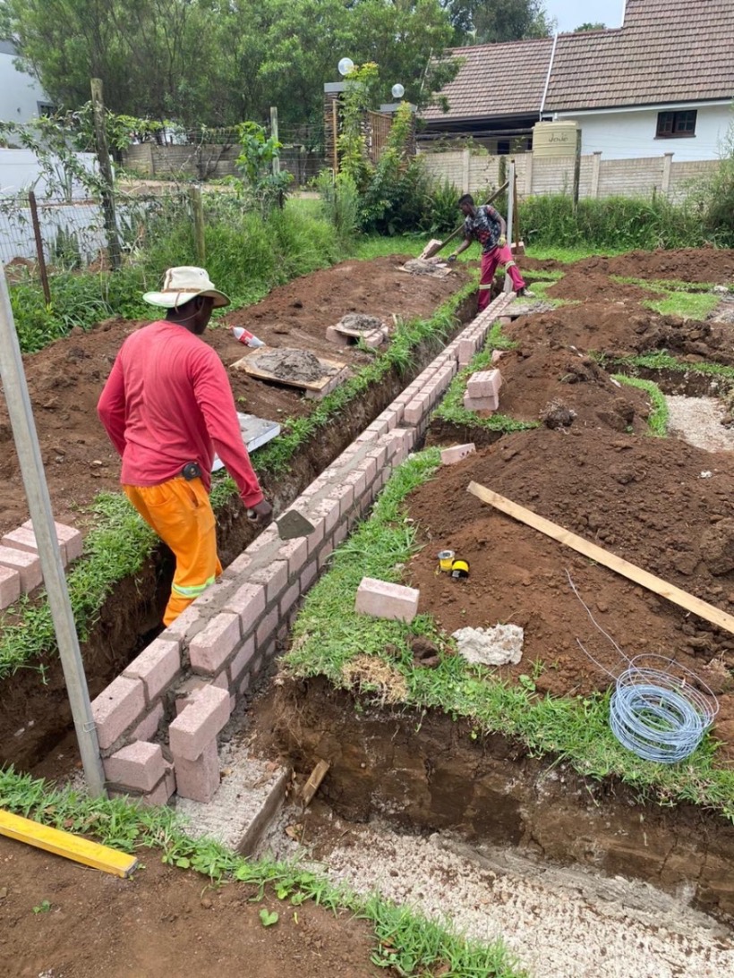 CVZ Solutions team laying foundation brickwork and footings for a residential building project in Hillcrest, Durban — experienced building contractors and construction specialists serving Durban, Westville, Hillcrest and KwaZulu-Natal