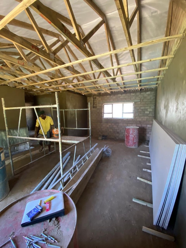 CVZ Solutions tradesman working on roof truss installation and internal plastering inside a new build in Durban, KwaZulu-Natal — expert roofing, plastering and building contractors serving Durban, Umhlanga, Hillcrest and KZN